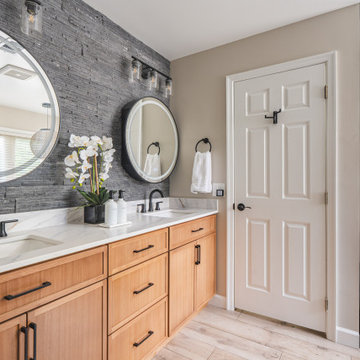 Bathroom Remodel in Sterling, VA Tub, glass shower, double vanity, stone wall