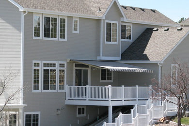 Patio - traditional backyard patio idea in Denver with decking and an awning