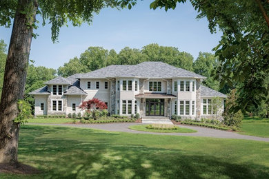 Example of a large trendy gray two-story mixed siding house exterior design in DC Metro with a hip roof and a shingle roof