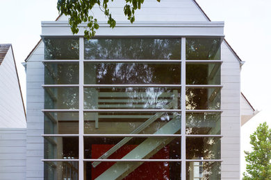 Mid-sized cottage white one-story brick exterior home photo in Atlanta with a hip roof