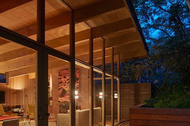 Inspiration for a small midcentury two-storey brown exterior in San Francisco with wood siding.