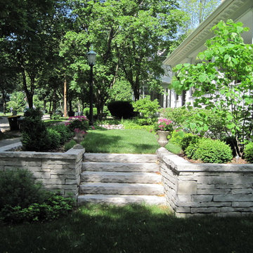 Stone steps lead down to the side garden