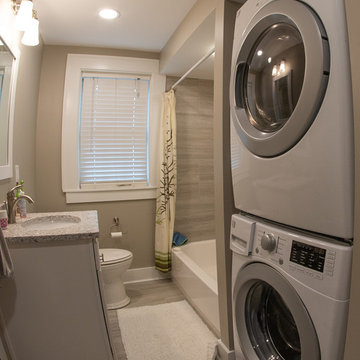 Transitional guest bath with a spa like feel and built in space for washer dryer