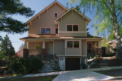 Example of a mid-sized two-story concrete fiberboard exterior home design in Seattle