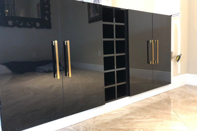 Kitchen/dining room combo - small traditional marble floor and beige floor kitchen/dining room combo idea in Miami with black walls and no fireplace