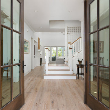 Light-filled Coastal Foyer with Wide-Plank Oak Floors