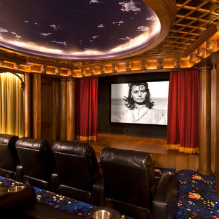 Design ideas for a large traditional enclosed home cinema in Detroit with yellow walls, carpet, a wall mounted tv and blue floors.