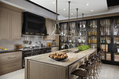 Large trendy u-shaped porcelain tile and beige floor open concept kitchen photo in Miami with an undermount sink, recessed-panel cabinets, brown cabinets, marble countertops, stainless steel appliances, an island and beige countertops