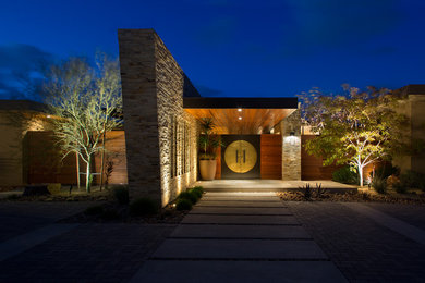 Example of a trendy entryway design in San Diego with a black front door