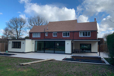 This is an example of a contemporary house exterior in Surrey.