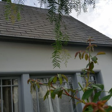 Bonderized Steel, 5 inch Half Round Seamless Gutters with Round Downspouts.