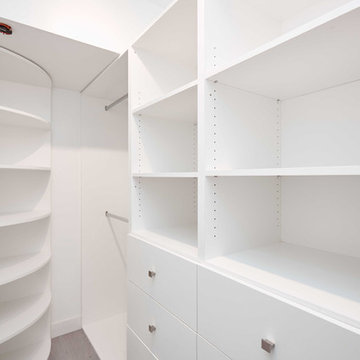 Custom Walk-In Closet With Curved Corner Shelving