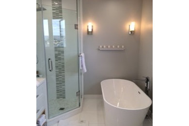 Mid-sized trendy master white tile marble floor bathroom photo in Toronto with a vessel sink, shaker cabinets, white cabinets, quartz countertops, a one-piece toilet and white walls