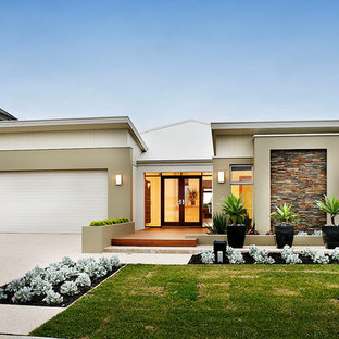 Design ideas for a contemporary one-storey beige house exterior in Perth with a flat roof and a mixed roof.