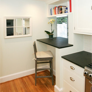 newly created pass-through in to dining room with cookbook storage above