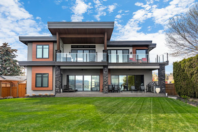 Inspiration for a contemporary multicolored two-story house exterior remodel in Other