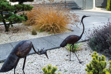 Black Heron. Modern fence made of concrete and aluminum
