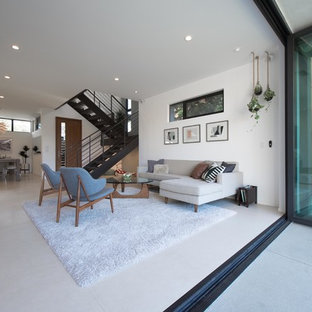 Exempel på ett stort modernt allrum med öppen planlösning, med vita väggar, klinkergolv i keramik och ett finrum