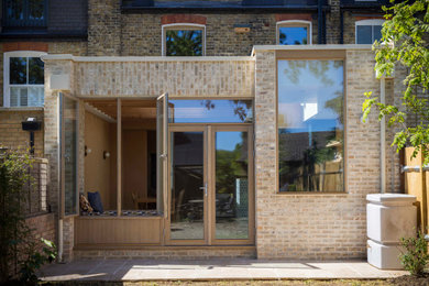 Inspiration for a contemporary brick house exterior in London.