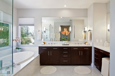 Example of a large trendy master marble floor bathroom design in Orange County with flat-panel cabinets, dark wood cabinets, a one-piece toilet, gray walls and an undermount sink