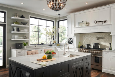 Example of a transitional dark wood floor and brown floor kitchen design in Chicago with an undermount sink, an island, recessed-panel cabinets, white cabinets, beige backsplash, mosaic tile backsplash, stainless steel appliances and white countertops