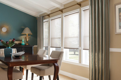 Example of a mid-sized trendy carpeted and beige floor kitchen/dining room combo design in Other with yellow walls and no fireplace