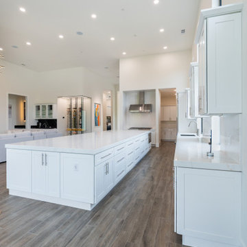 Modern White Shaker Kitchen with Oversized Island & Custom Storage Solutions