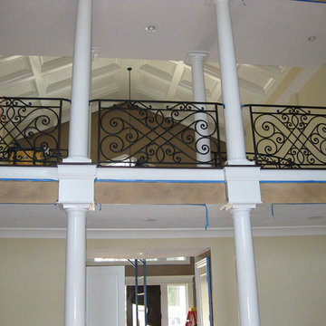 Steel interior rails with hand formed scrolls