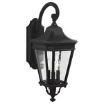Generation Lighting Collection - Cotswold Lane Medium Lantern, Black - The Feiss Cotswold Lane three light outdoor wall fixture in black enhances the beauty of your property, makes your home safer and more secure, and increases the number of pleasurable hours you spend outdoors. The traditional, antique gas lantern-inspired design of Cotswold Lane features dentil molding at the top of each pane of beveled glass. Cotswold Lane's profile is timeless and elegant. Available with two finish and glass options: a Black or Grecian Bronze frame with Clear Beveled glass or Clear Seeded glass panels.