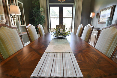 Mid-sized transitional separate dining room in Austin with grey walls and medium hardwood floors.