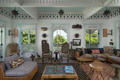 Example of an island style living room design in Other