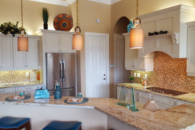 Mid-sized elegant l-shaped eat-in kitchen photo in Miami with shaker cabinets, white cabinets, granite countertops, multicolored backsplash, mosaic tile backsplash, stainless steel appliances and a peninsula