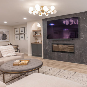 Warm & Inviting Basement Retreat with Custom Bar + Entertainment Center