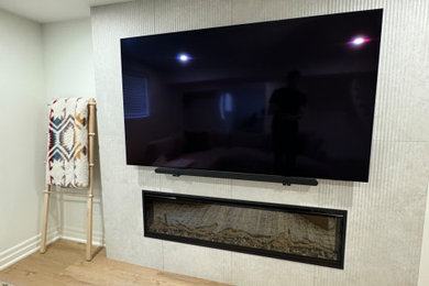 Inspiration for a mid-sized contemporary vinyl floor basement remodel in Toronto