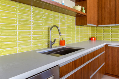 Example of a 1950s kitchen design in San Luis Obispo with green backsplash and ceramic backsplash