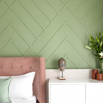 The fresh pastel green stands out in this room