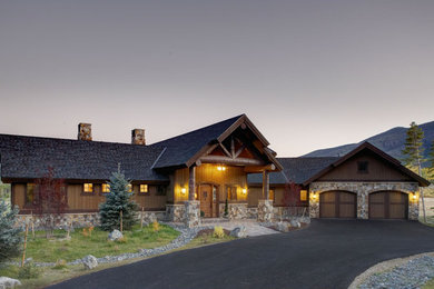 Inspiration for a large rustic brown one-story mixed siding exterior home remodel in Denver with a shingle roof