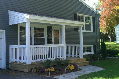 Inspiration for a small green one-story wood exterior home remodel in Boston