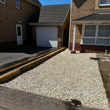 Gravel Front Drive With Timber Edging to the Path