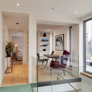 Medium sized modern home office and library in London.