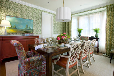 Large traditional separate dining room in Chicago with green walls and medium hardwood floors.