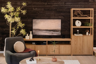 Trendy light wood floor and wood wall living room photo in Seattle