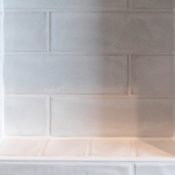 Master Bathroom Remodel — Navy Vanity, Herringbone Floor & Custom Tile Shower