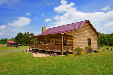 Inspiration for a mid-sized rustic brown one-story wood gable roof remodel in Huntington
