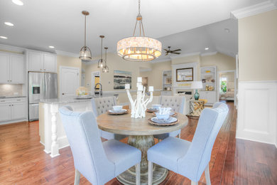 Mid-sized transitional medium tone wood floor and brown floor kitchen/dining room combo photo in Other with beige walls and no fireplace