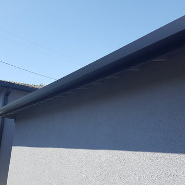 Black Gutters and Downspouts Contemporary Home, West Los Angeles