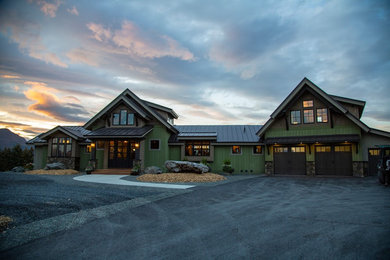 Inspiration for a rustic house exterior remodel in Other with a metal roof