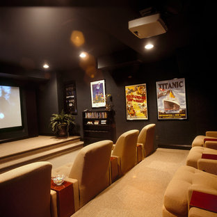 This is an example of a large contemporary enclosed home cinema in Newark with green walls, carpet and a projector screen.