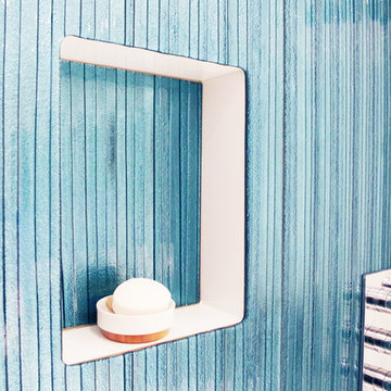 Bathroom feature wall in blue glass