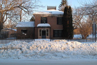 Inspiration for a mid-sized timeless two-story brick exterior home remodel in Minneapolis